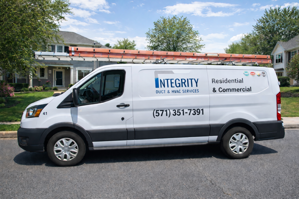 Integrity Duct & HVAC service van with ladders mounted on top